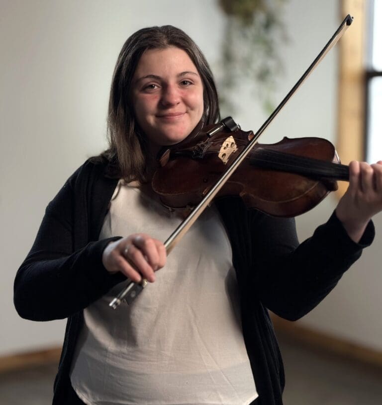 Madeline Carter is a fiddler originally from Aulac, New Brunswick who has been playing for 15 years. Playing a variety of different genres of music including Celtic, Country, and Folk, she also composes her own music. Along with her sisters, they make up “The Carter Girls” and their debut album "Crossing Borders" was released in July of 2020 featuring 6 original tunes. The album was recorded at "The Loft Studio" in Moncton, New Brunswick with the help of Studio Engineer and good friend Tyler Vollrath. Now living in St. John’s, Newfoundland, Madeline has graduated and received her diploma for Music Performance Business and Technology at College of the North Atlantic.
